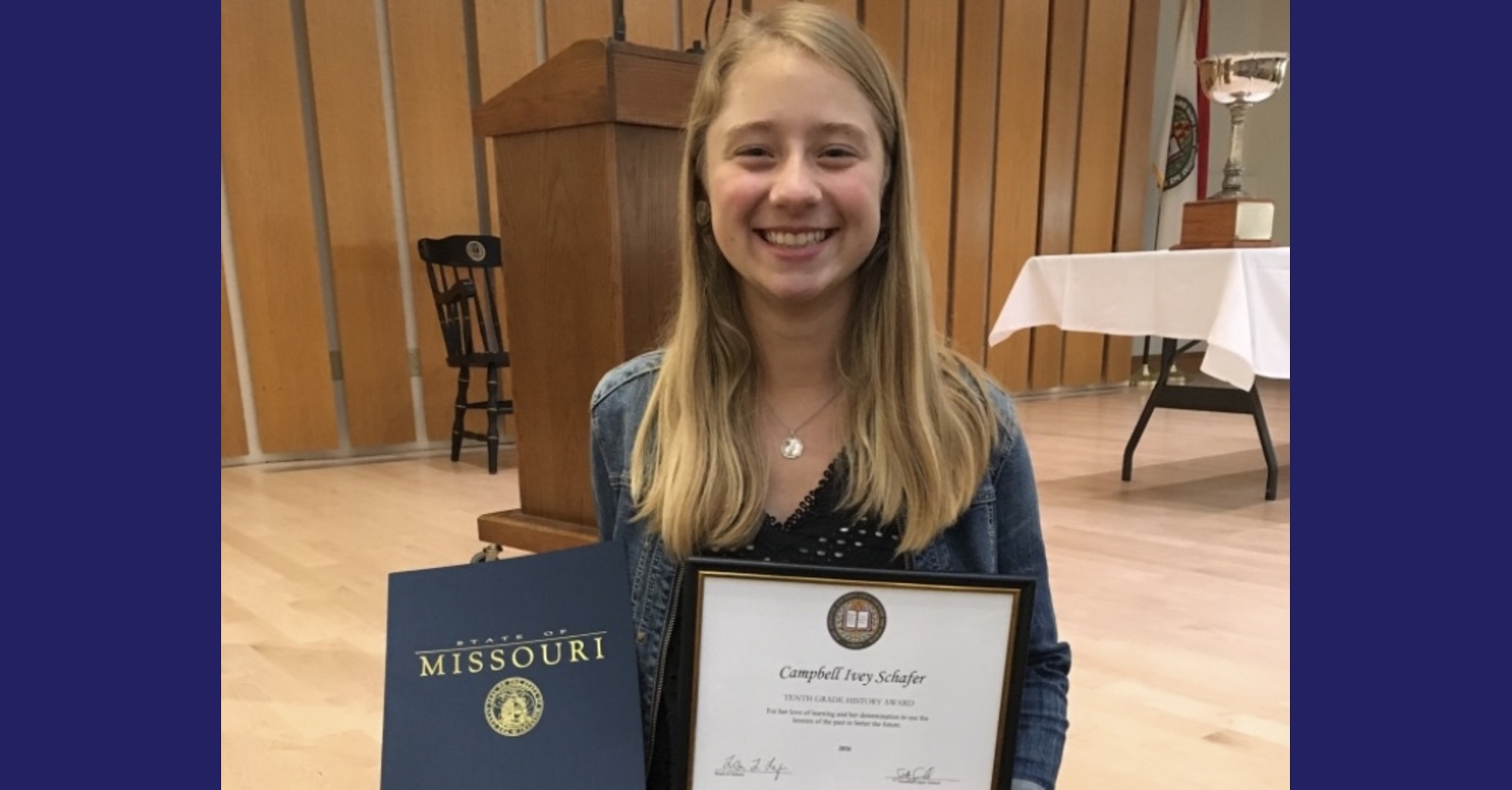 Campbell Schafer, Co-Founder and COO of EducAIte, holding her tenth grade history award and State of Missouri recognition